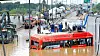 A rescue team on Sunday searches for bodies in the bus that was submerged in a flooded underpass in Osong-eup in Cheongju, North Chungcheong. [KIM SEONG-TAE]