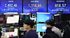 Screens in Hana Bank's trading room in central Seoul show stock and foreign exchange markets open on Thursday. [YONHAP]
