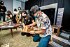 Visitors to Samsung Electronics' Neo QLED TV launch event in Singapore repurpose a paper carrier from the company's eco-friendly package box. [NEWS1]