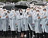 President Yoon Suk-yeol, center right, and first lady Kim Keon-hee, center left, salute the flag in a ceremony marking the 67th Memorial Day at the Seoul National Cemetery in Dongjak District, southern Seoul, Monday. [YONHAP]