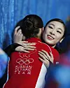 Silver medalist Kim Yuna of Korea, right, hugs gold medalist Adelina Sotnikova of Russia after the ladies' figure skating free skating event at the 2014 Sochi Winter Olympic Games in Sochi, Russia on Feb. 20, 2014. [XINHUA/YONHAP]