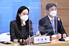 Oh Yoon-hae, a researcher at Korea Development Institute (KDI)’s markets and institutions department, left, and Kim Mee-roo, a researcher at KDI’s knowledge economy department, talk about the effectiveness and implications of the first emergency relief grants that were distributed to the public in May at the government complex in Sejong City on Wednesday. [YONHAP]