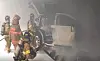 Fire fighters extinguish a Tesla Model X electric car that caught fire in an underground parking garage in Seoul on Wednesday. The accident killed one person and injured two. [YONGSAN FIRE STATION]