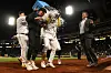 Choi Ji-man, left, and Jack Suwinski, right, douse Bae Ji-hwan, center, after Bae hit a walk-off three-run home run for a 7-4 win over the Houston Astros at PNC Park in Pittsburgh on Tuesday. [AFP/YONHAP]