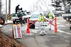 Quarantine officials block a road leading to a pig farm in the county of Yangyang, Gangwon, on Feb. 12, 2023, after confirming an African swine fever case there. [YONHAP]