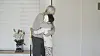 Kim Tschang-yeul hugs his grandson in 'The Man Who Paints Water Drops.' [MIRU PICTURES]