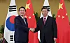 President Yoon Suk-yeol, left, shakes hands with Chinese President Xi Jinping ahead of their first bilateral summit on the sidelines of the G20 summit in Bali, Indonesia Tuesday. [JOINT PRESS CORPS]