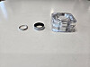 From left, a ring from a jewelry brand, the Galaxy Ring in silver shade, and its charger [JIN EUN-SOO]