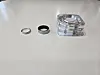 From left, a ring from a jewelry brand, the Galaxy Ring in silver shade, and its charger [JIN EUN-SOO]