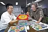 Master artisan Lee Soo-kyung, right, and his son work together on an art piece. [PARK SANG-MOON]