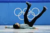 Lee Si-hyeong falls during the men's short program figure skating competition at the 2022 Winter Olympics on Tuesday. [AP/YONHAP]