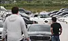 Cars being submerged in water after a sudden rainfall at a parking lot in Suwon on June 30. [NEWS1]