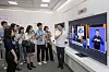 A Samsung researcher explains a feature of its AI TV lineup that allows users with hearing impairments to enlarge the on-screen sign language interpreter for easier viewing. [SAMSUNG ELECTRONICS]