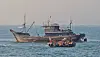 A South Korean Coast Guard vessel approaches a Chinese boat fishing illegally near Yeonpyeong Island on April 19. [YONHAP]