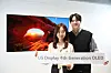 Models pose with LG Display's 4th Generation OLED panel. [LG DISPLAY]