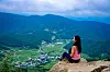 The Meditation Rock at Hwarang Hill, Gyeongju, North Gyeongsang, is an attractive photo spot that presents a view of the village beneath. [BAEK JONG-HYUN]