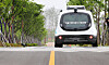 An autonomous vehicle test runs at a park in Sejong on May 25. [YONHAP]