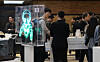 Visitors browse the exhibition booths set up at the Semicon Korea 2024, a three-day semiconductor industry trade fair, which kicked off on Wednesday at COEX in southern Seoul. [YONHAP]