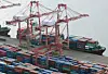 Containers for exports and imports are piled at a pier in the southeastern port city of Busan on Jan. 1, 2024. [Yonhap]