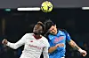 Roma's Tammy Abraham, left, jumps to head the ball against Napoli's Kim Min-jae during a Serie A match in Naples on Sunday. [AFP/YONHAP]