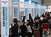 Job seekers browse booths at the 2025 Global Talent Fair, a job expo held at Coex in Gangnam District, southern Seoul, on May 19. [YONHAP]
