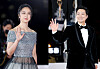 Actors Tang Wei, left, and Park Hae-il attend the red carpet event of the 2022 Blue Dragon Film Awards at KBS Hall in western Seoul on Friday. The two were each named Best Actor and Best Actress for their performances on romance thriller 'Decision to Leave' (2022). [NEWS1]