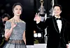 Actors Tang Wei, left, and Park Hae-il attend the red carpet event of the 2022 Blue Dragon Film Awards at KBS Hall in western Seoul on Friday. The two were each named Best Actor and Best Actress for their performances on romance thriller 'Decision to Leave' (2022). [NEWS1]