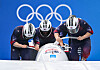 Pilot Won Yun-jong, brakeman Kim Jin-su, pushers Jung Hyun-woo and Kim Dong-hyun compete during the bobsleigh four-man heat at the Beijing 2022 Winter Olympics at the National Sliding Centre in Yanqing, Beijing on Sunday. [XINHUA/YONHAP]