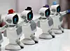 Robot speakers dance along to music at a booth at the ″2021 Smart Device Trade Show″ at Coex, southern Seoul on Thursday. The show kicked off Thursday and will run through Saturday. [YONHAP]