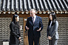 Colin Crooks, the British ambassador to Korea, center, speaks with winners of the International Women's Day Essay Writing Competition, Park Se-yeon, left, and Park Eo-jin, right, at the British Embassy in Seoul on Wednesday. [KIM HYUN-DONG]