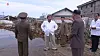 North Korean leader Kim Jong-un, center, inspects an area damaged by Typhoon Maysak in the country's eastern South Hamkyong Province, in a photo published by the Rodong Sinmun, the official newspaper of the ruling party, earlier this month. [YONHAP]
