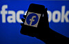 A smartphone screen displays the logo of Facebook [YONHAP]