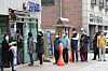 People line up in front of a drug store in Jongno District, central Seoul, to receive publicly-distributed masks on March 21. The national health insurance database was used in limiting the masks to two per person every week as there was a surge in demand after the number of coronavirus cases shot up after many Shincheonji members especially in Daegu contracted the virus, forcing the city to lock down. [YONHAP]