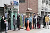 People line up in front of a drug store in Jongno District, central Seoul, to receive publicly-distributed masks on March 21. The national health insurance database was used in limiting the masks to two per person every week as there was a surge in demand after the number of coronavirus cases shot up after many Shincheonji members especially in Daegu contracted the virus, forcing the city to lock down. [YONHAP]