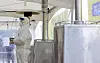 A medical worker warms up in front of a heater earlier this month at a Covid-19 testing site in Yongsan District, central Seoul. [YONHAP]