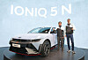 Hyundai Motor CEO Chang Jae-hoon, left, and Till Wartenberg, vice president and head of N Brand and Motorsport at Hyundai Motor, pose with the Ioniq 5 N at the Goodwood Festival of Speed held in West Sussex, Britain on Thursday. [HYUNDAI MOTOR]