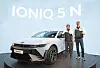 Hyundai Motor CEO Chang Jae-hoon, left, and Till Wartenberg, vice president and head of N Brand and Motorsport at Hyundai Motor, pose with the Ioniq 5 N at the Goodwood Festival of Speed held in West Sussex, Britain on Thursday. [HYUNDAI MOTOR]