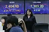 A screen in Hana Bank's trading room in central Seoul shows stock and foreign exchange markets open on Friday. [NEWS1]