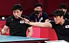 Korea's Kim Young-gun, left, and Kim Jung-gil take on China's Cao Ningning and Guo Xingyuan in the men's team class four to five gold medal match on Thursday. [NEWS1]
