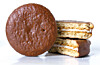Orion Choco Pie 초코파이 boxes and individual marshmallow filled chocolate coated snack cakes displayed as an iconic Korean sharing food that Korean students and soldiers have used for generations before becoming the base ingredient of the microwaved Choco Pie plus vanilla ice cream sandwich 초코파이 아이스크림 샌드위치 TikTok K-snack upgrade hack