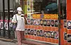 A person passes by a restaurant in Seoul on July 17. [YONHAP]