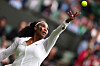 Serena Willams of the United States serves during her first round match against France's Harmony Tan at the All England Lawn Tennis and Croquet Club in London on Tuesday. [REUTERS/YONHAP]