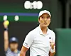 Harmony Tan celebrates after scoring against Serena Williams during the women's singles first round match at the All England Lawn Tennis and Croquet Club in London on Tuesday. [REUTERS/YONHAP]