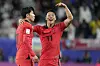 Korea's Son Heung-min, left, celebrates with Hwang Hee-chan after scoring his side's second goal during an Asian Cup quarterfinal against Australia at Al Janoub Stadium in Qatar on Friday. [AP/YONHAP]