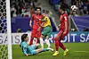 Korea goalkeeper Jo Hyeon-woo, left, saves a shot by Australia's Martin Boyle, center. [AP/YONHAP]