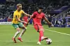 Australia's Nathaniel Atkinson, left, and Korea's Cho Gue-sung challenge for the ball [AP/YONHAP]