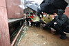 President Yoon Suk-yeol and Seoul Mayor Oh Se-hoon, second and third from left, inspect flood damage in Sillim-dong, Gwanak District, southern Seoul on Tuesday. [JOINT PRESS CORPS]