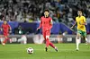 Korea's Son Heung-min, center, passes the ball as Australia's Keanu Baccus, right, challenges. [AP/YONHAP]