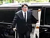 HYBE Chairman Bang Si-hyuk enters Lotte Hotel Seoul on Tuesday for a tea meeting with UAE President Mohamed bin Zayed Al Nahyan. [YONHAP]