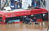 Rescue team searching for survivors on the bus that drowned in an underpass in Osong, North Chungcheong, on Sunday. Among the 13 people that died, five were on the bus including the driver. [YONHAP]